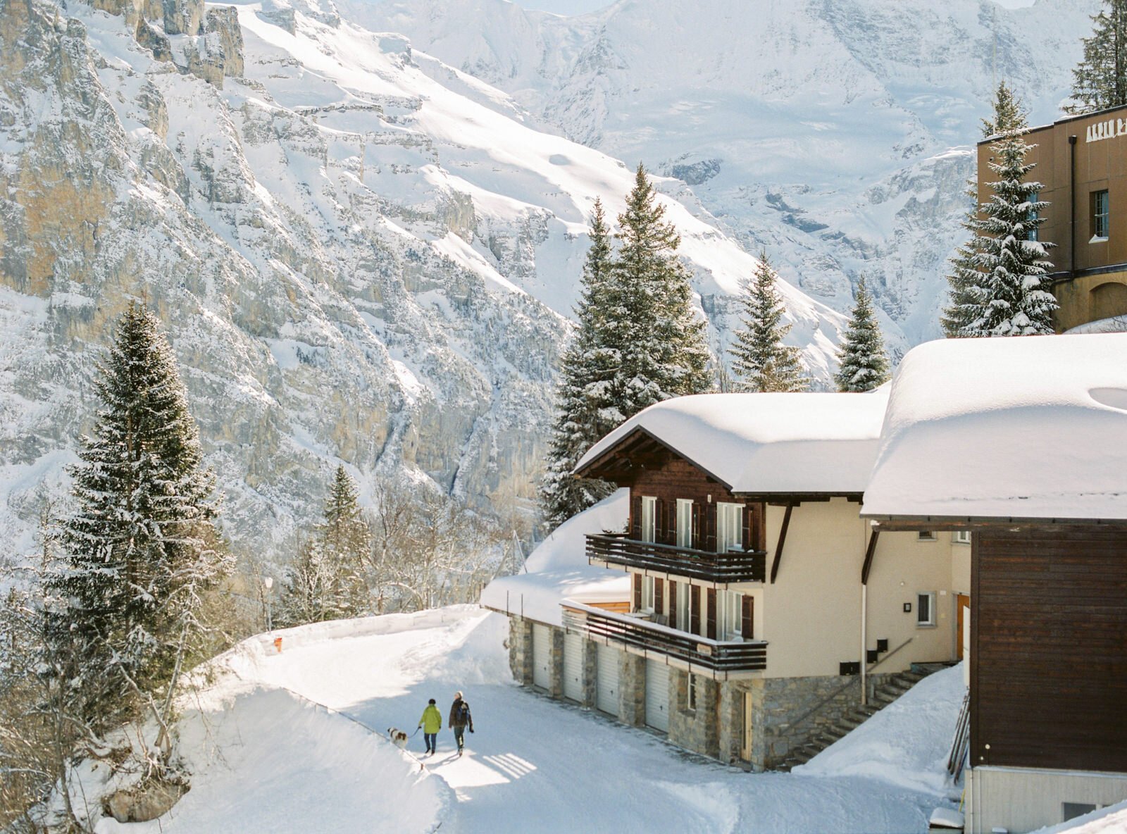 a house with snow in mountains in switzerland